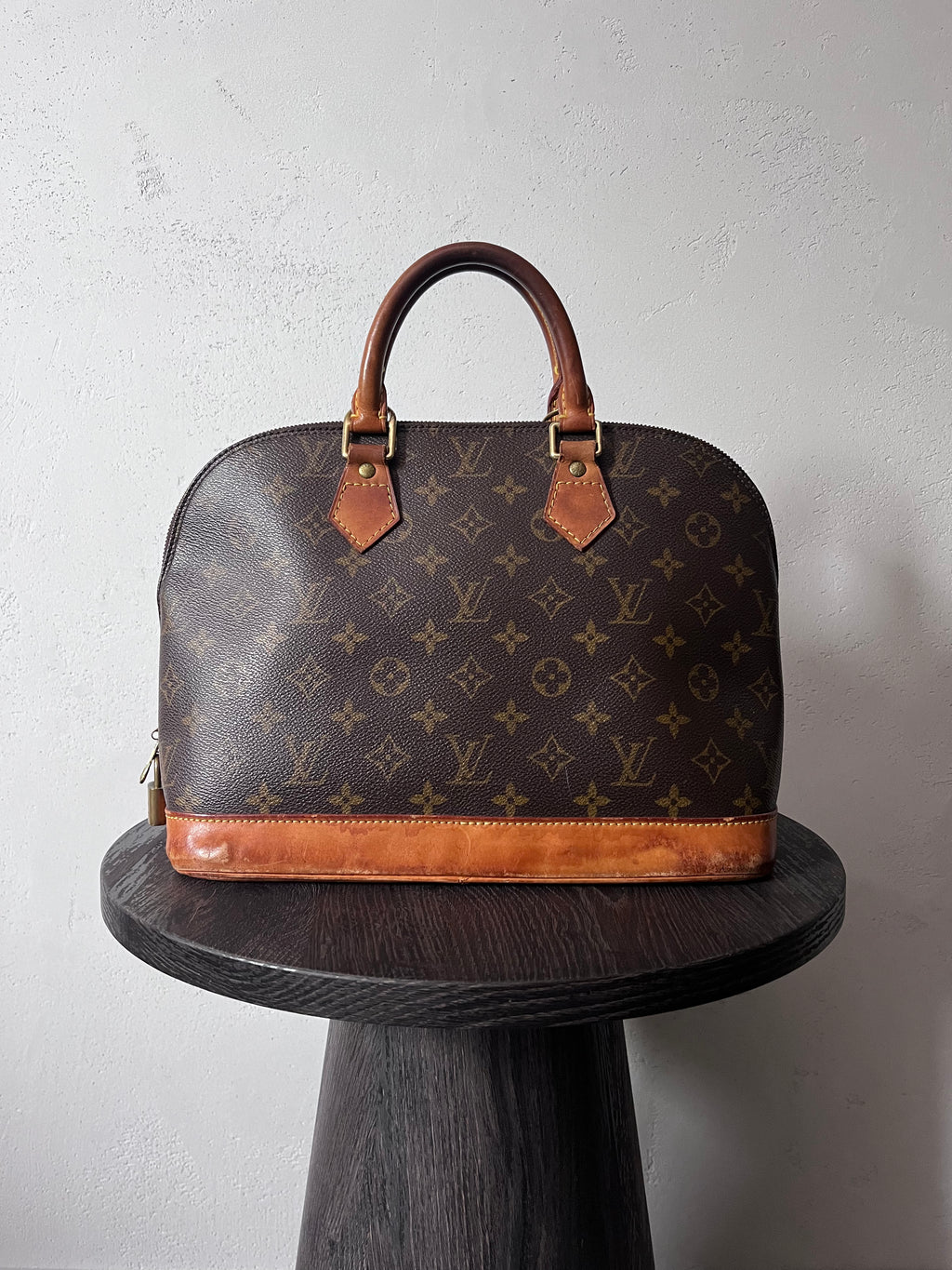 Louis Vuitton Alma Monogram Handbag Brown
