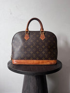 Louis Vuitton Alma Monogram Handbag Brown