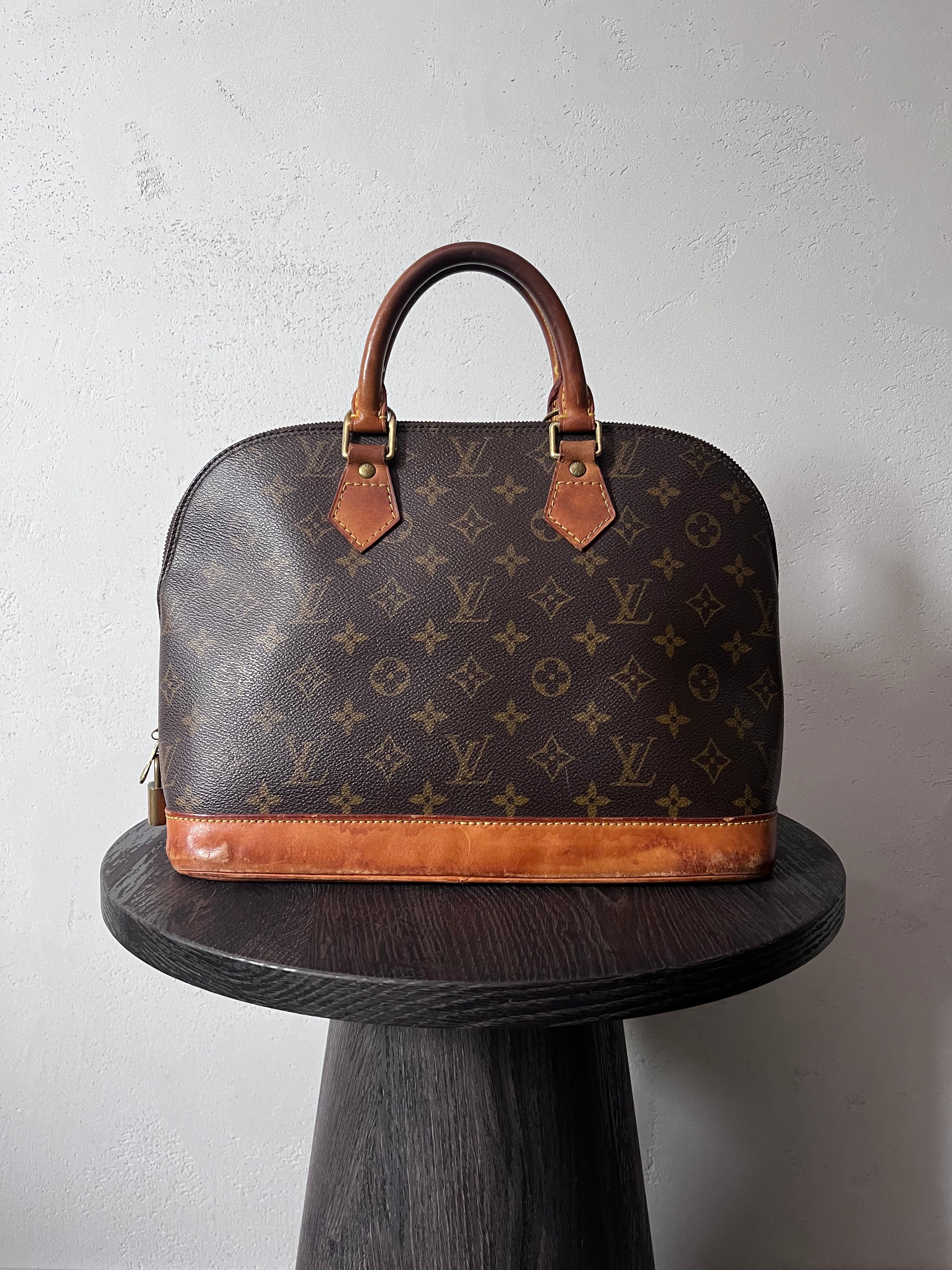 Louis Vuitton Alma Monogram Handbag Brown