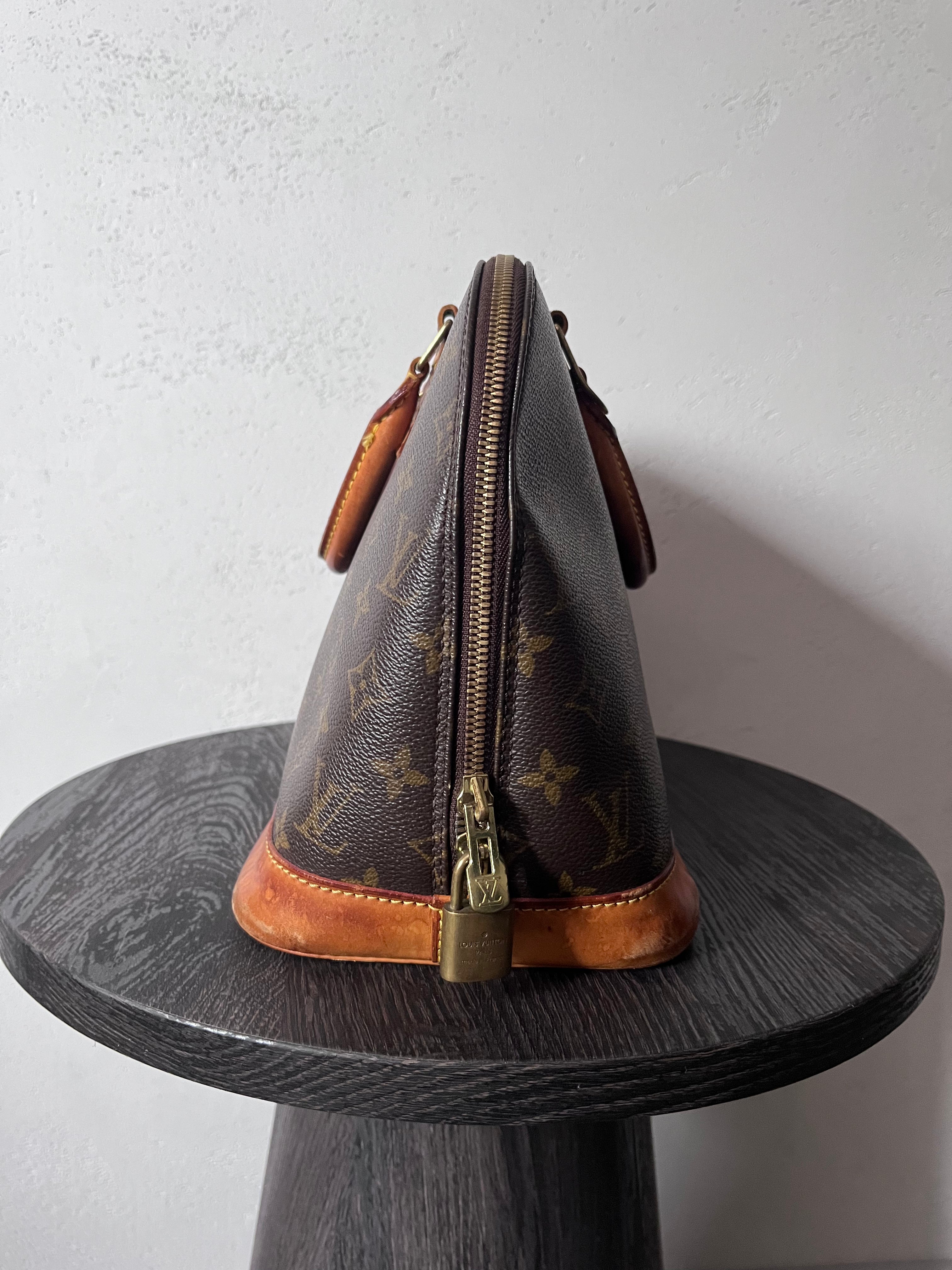 Louis Vuitton Alma Monogram Handbag Brown