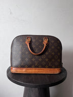 Louis Vuitton Alma Monogram Handbag Brown