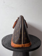 Louis Vuitton Alma Monogram Handbag Brown