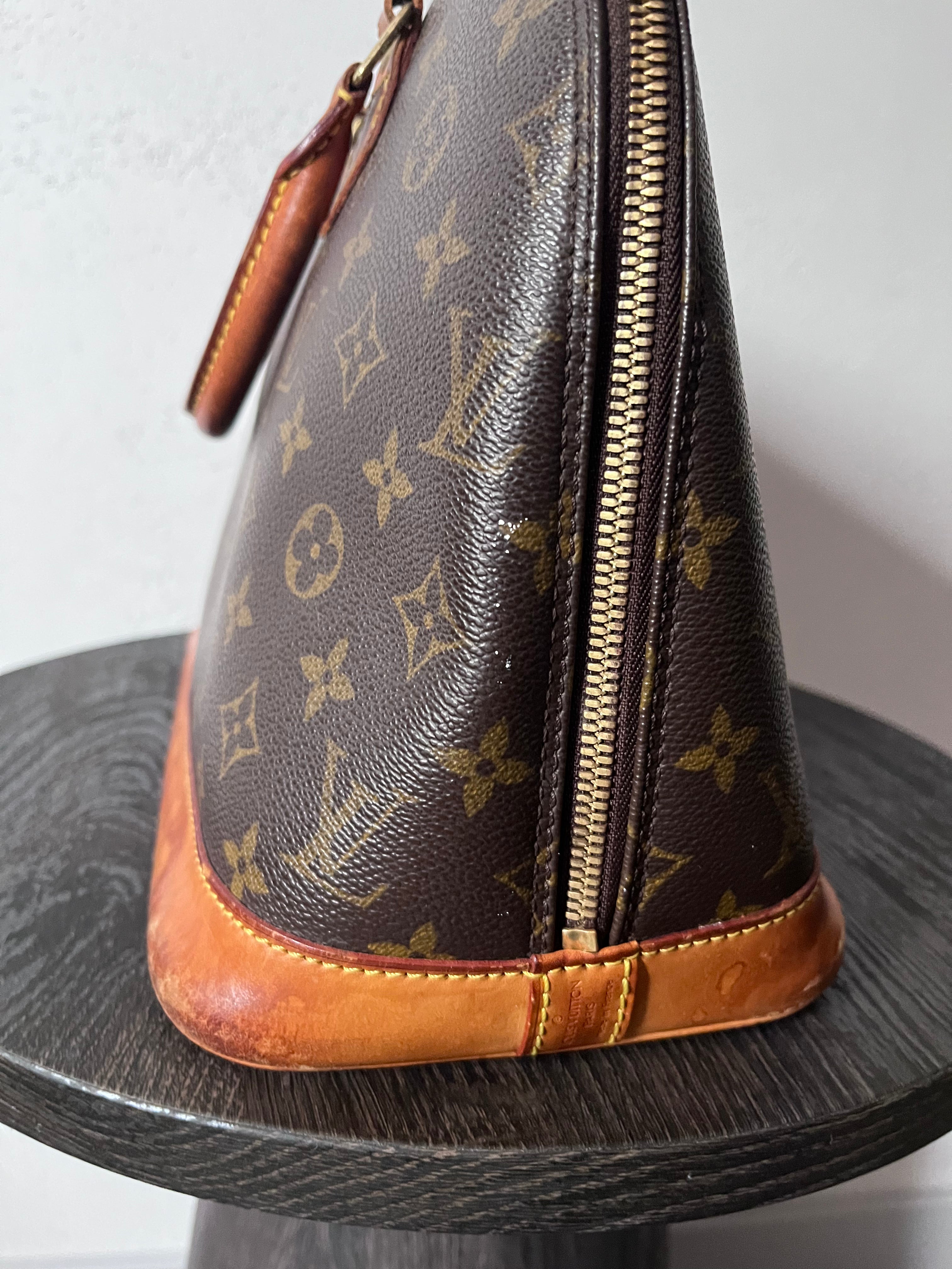 Louis Vuitton Alma Monogram Handbag Brown