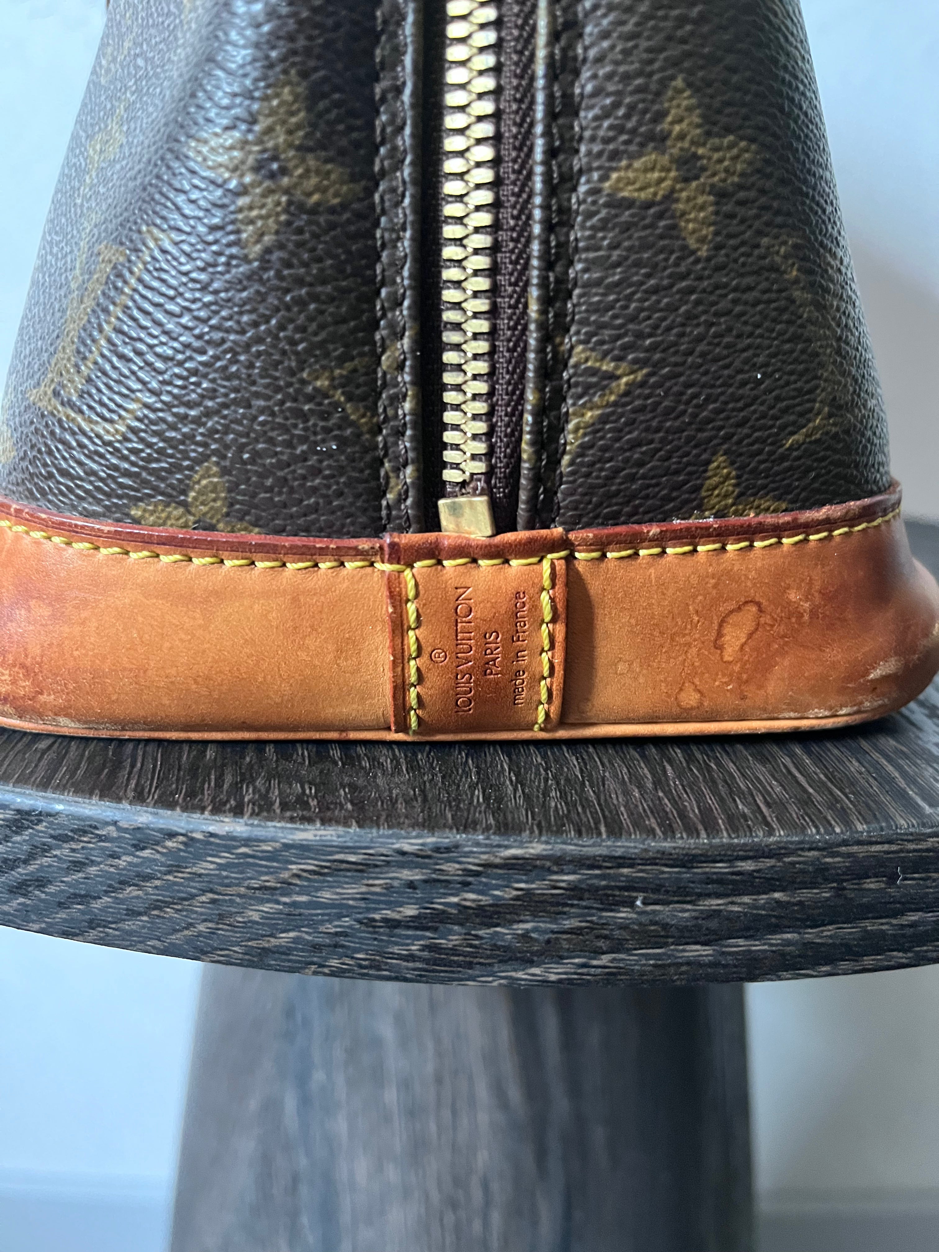 Louis Vuitton Alma Monogram Handbag Brown