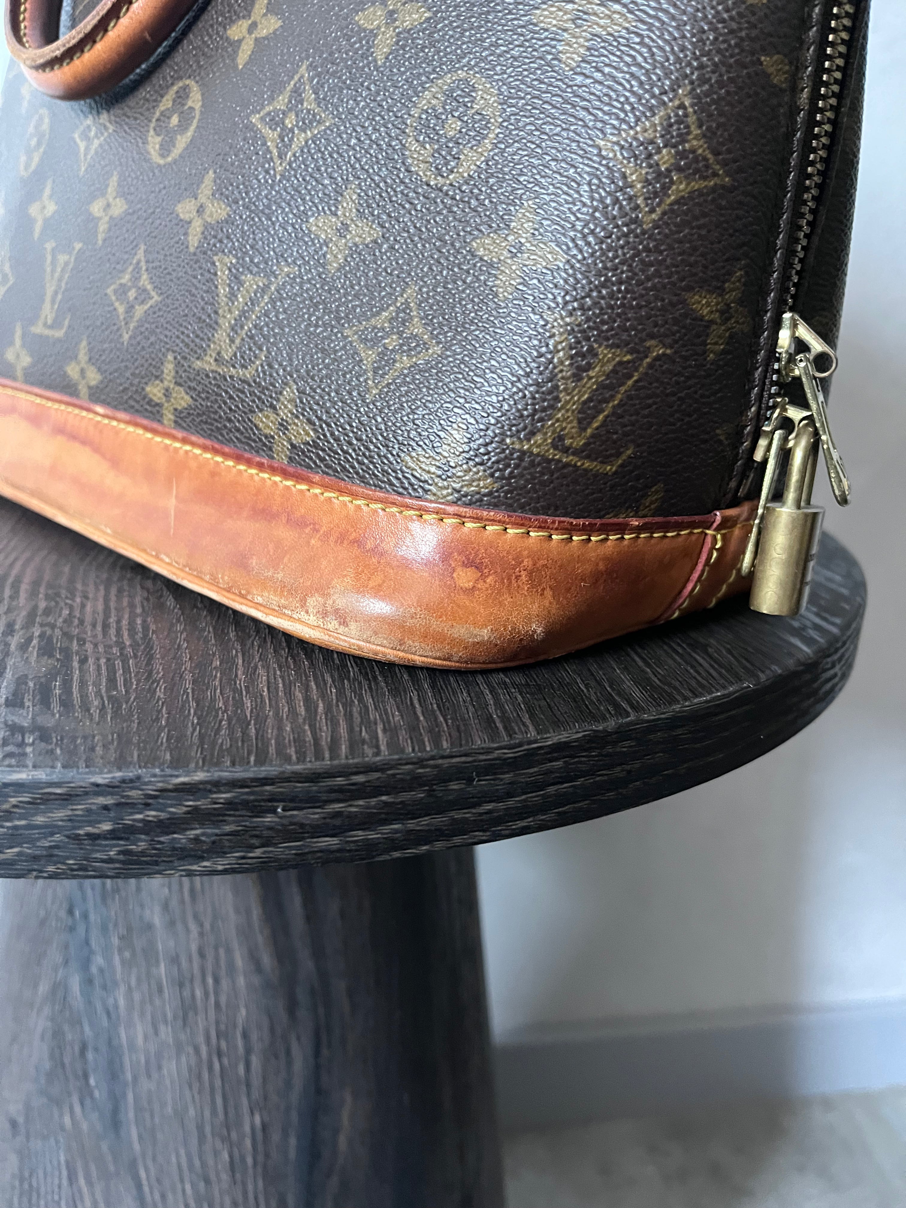 Louis Vuitton Alma Monogram Handbag Brown