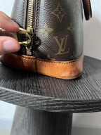 Louis Vuitton Alma Monogram Handbag Brown