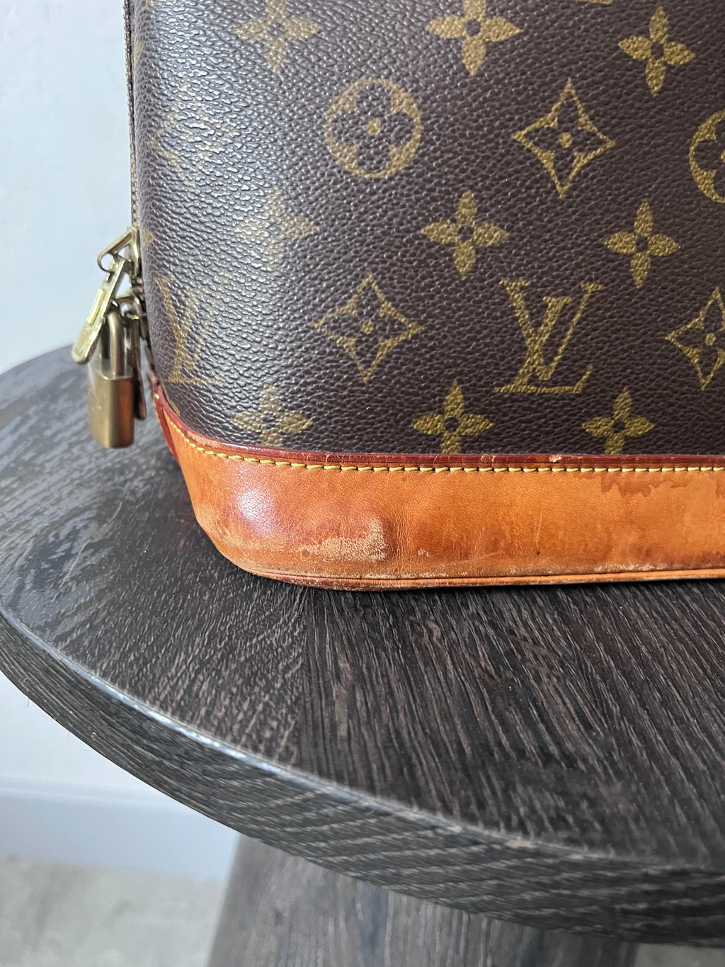 Louis Vuitton Alma Monogram Handbag Brown
