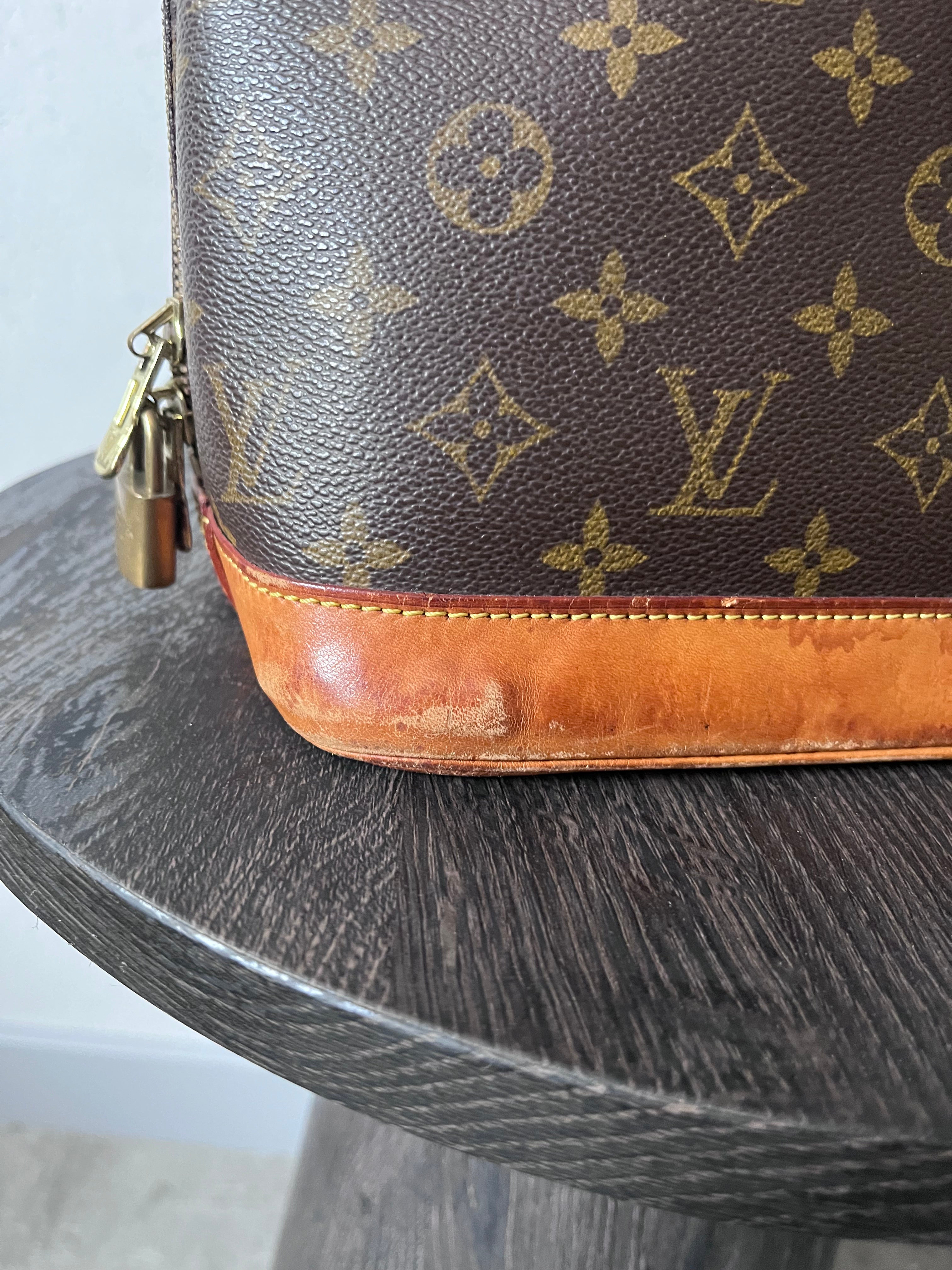 Louis Vuitton Alma Monogram Handbag Brown