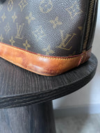 Louis Vuitton Alma Monogram Handbag Brown