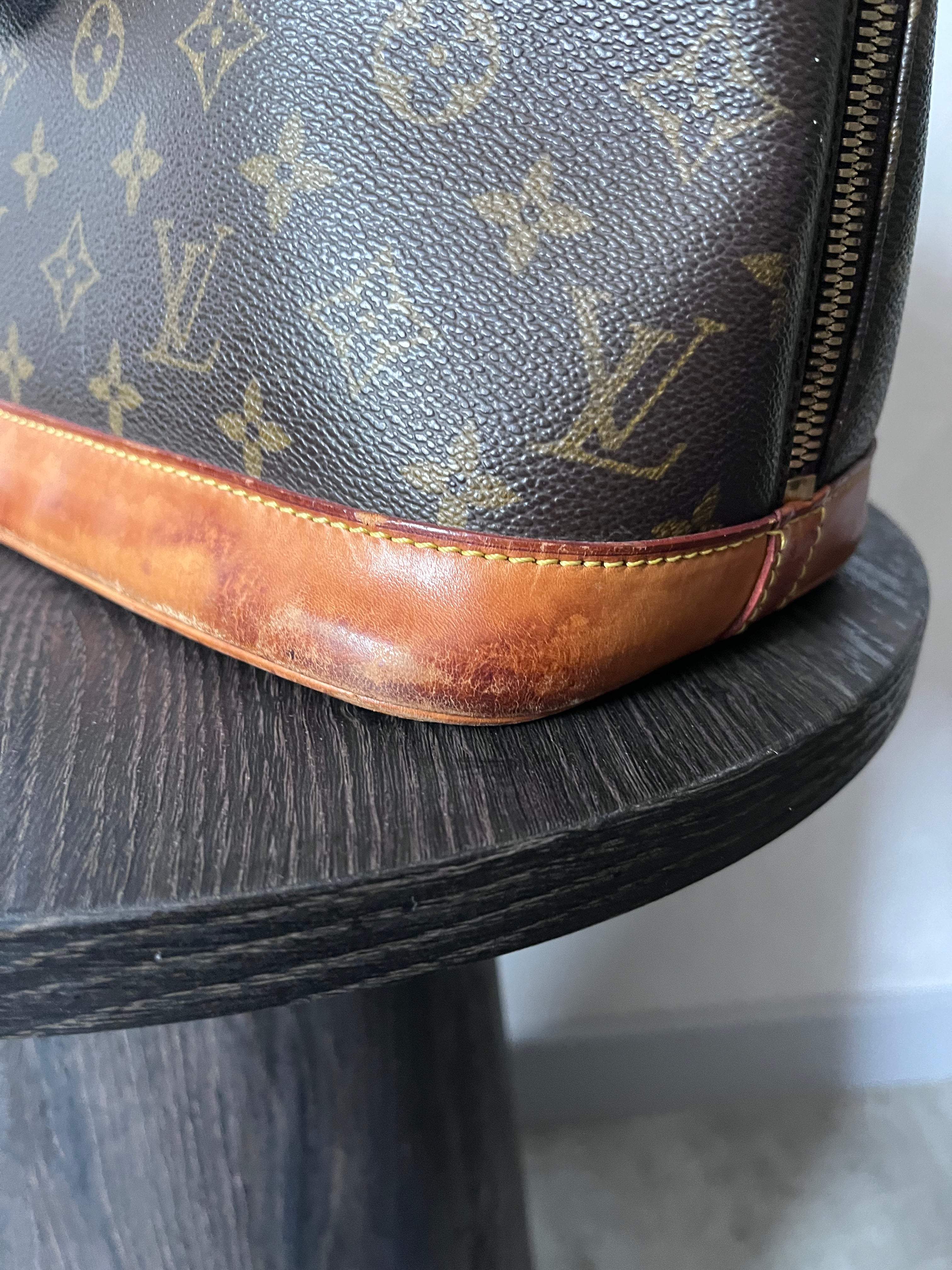 Louis Vuitton Alma Monogram Handbag Brown