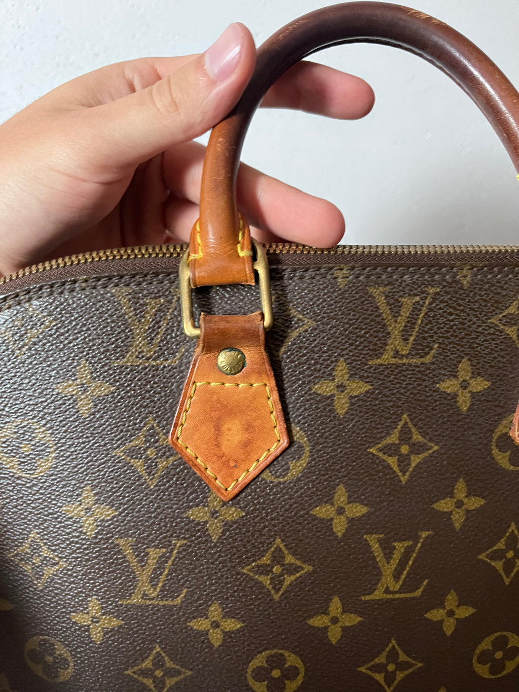 Louis Vuitton Alma Monogram Handbag Brown