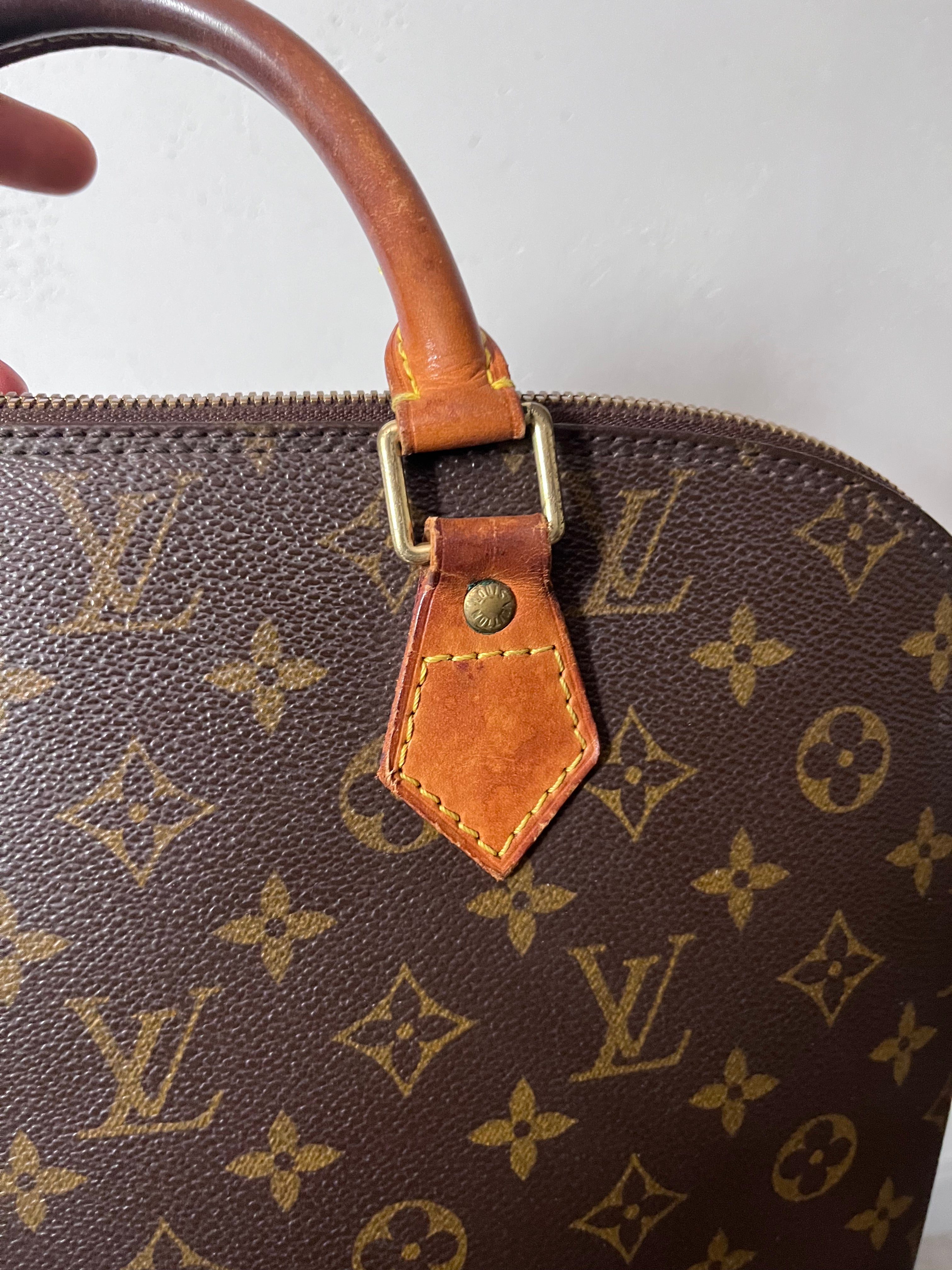 Louis Vuitton Alma Monogram Handbag Brown