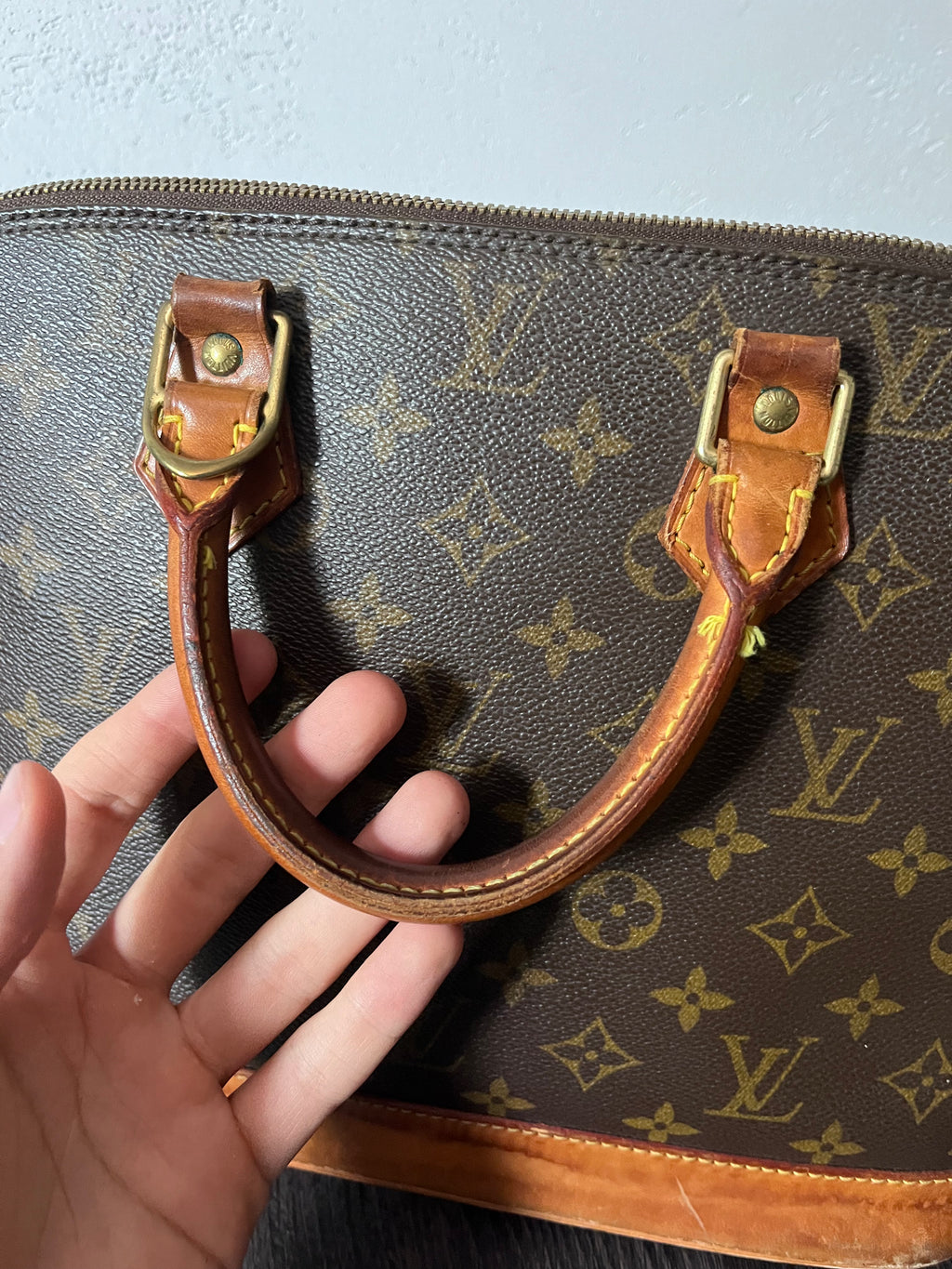 Louis Vuitton Alma Monogram Handbag Brown