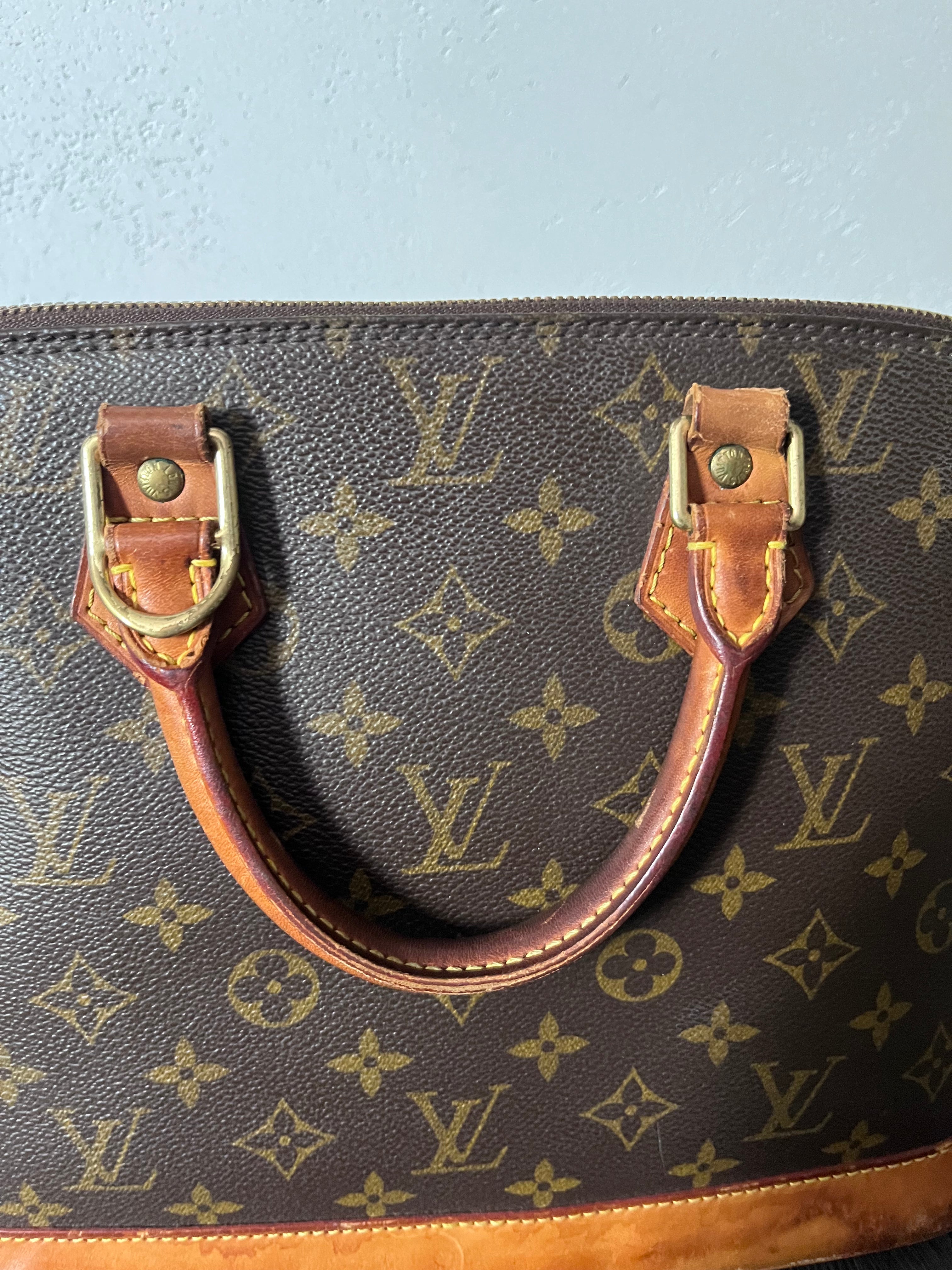 Louis Vuitton Alma Monogram Handbag Brown
