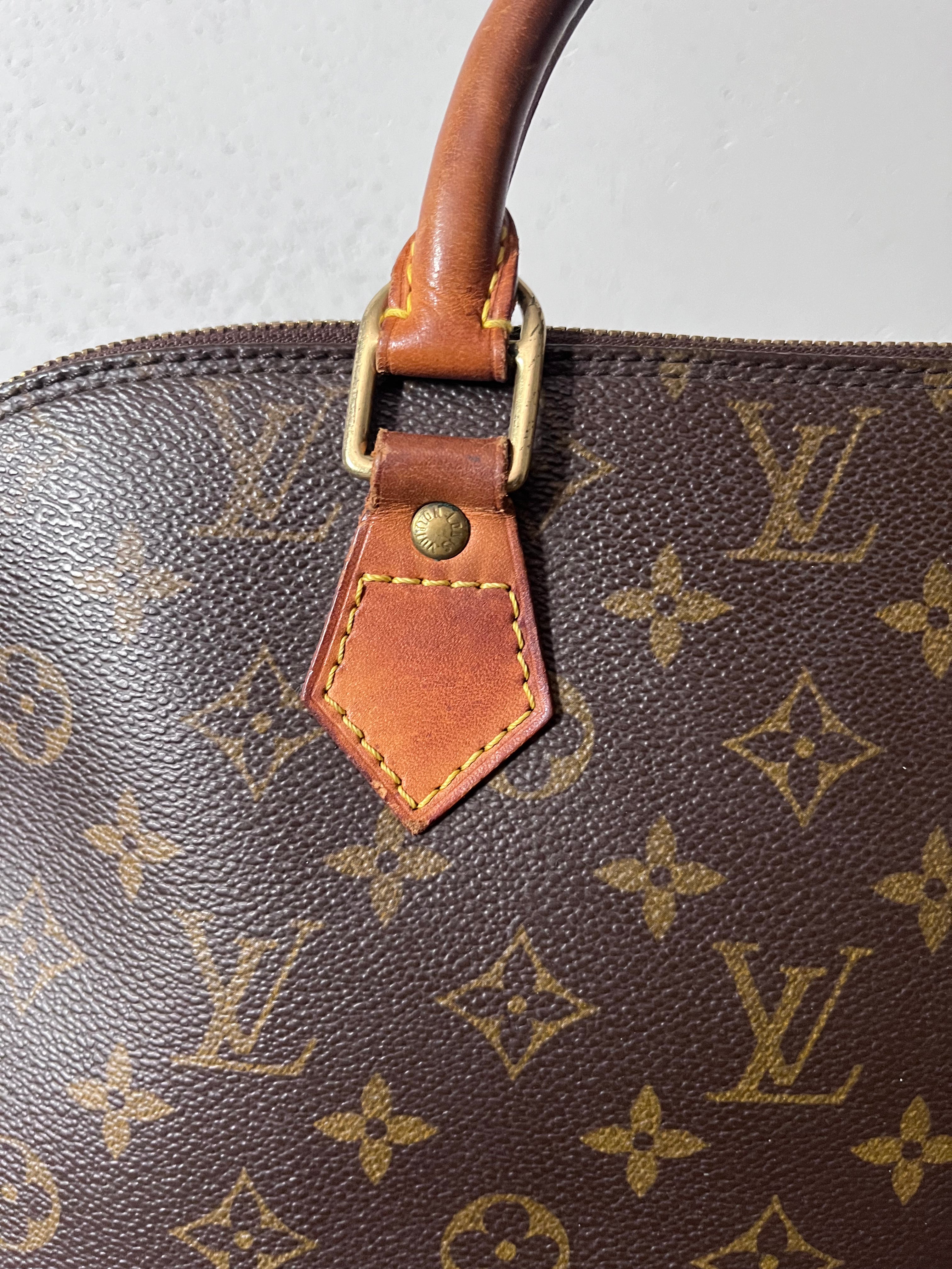 Louis Vuitton Alma Monogram Handbag Brown