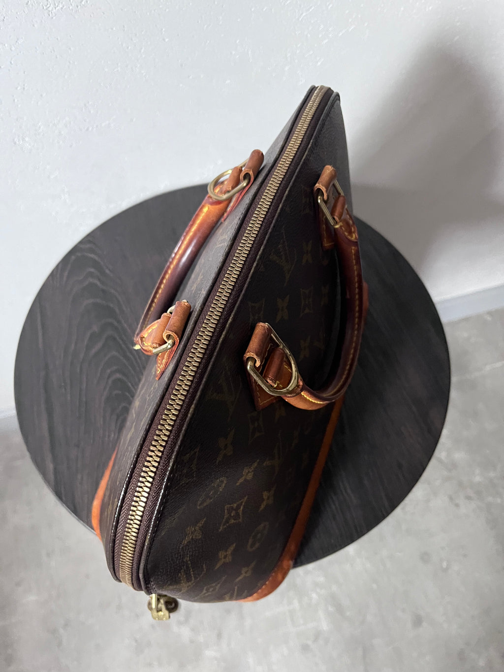 Louis Vuitton Alma Monogram Handbag Brown